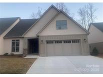 Charming home with a neutral color palette, complemented by stone accents and an attached two-car garage at 4033 Stadler Ne Dr # 22, Conover, NC 28613
