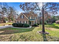 Brick house with a two-car garage and landscaping at 116 Diamond Head Dr, Mooresville, NC 28117