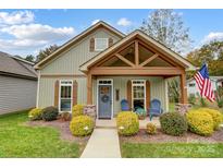 Charming craftsman style home with front porch and landscaping at 226 Hickory St, Locust, NC 28097