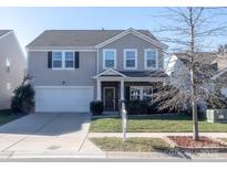 Two-story house with attached garage and front yard at 3960 Farmington Ridge Pkwy, Charlotte, NC 28213