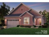 Beautiful rendering of a brick home with a two-car garage and charming curb appeal at 411 Newstyle Way # 4, Cramerton, NC 28056