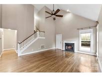 Bright living room with hardwood floors and fireplace at 7708 Spanish Oaks Dr, Waxhaw, NC 28173