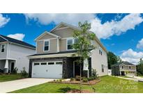 Charming two-story home featuring a stone facade and well-manicured front lawn, offering great curb appeal at 827 Blue Canyon Dr, York, SC 29745