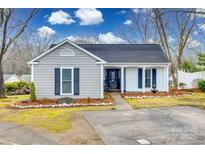 Charming ranch home with gray siding, white trim, and landscaped yard at 2722 Hillmont Dr, Charlotte, NC 28226