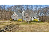 Stately home with beautiful stone accents and manicured landscaping at 4006 Sincerity Rd, Monroe, NC 28110