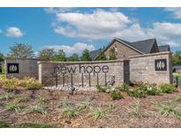 Welcome to New Hope! Beautiful community entrance with brick signage and lush landscaping at 405 Newstyle Way # 1, Cramerton, NC 28056