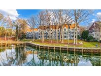 Waterfront community with multiple buildings and a boardwalk at 703 Southwest Dr, Davidson, NC 28036