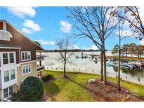 View of lakefront property with boats and a marina at 703 Southwest Dr, Davidson, NC 28036