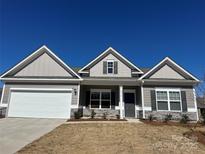 Charming one story home with a two car garage and stone accents at 6319 Honor Ave, Midland, NC 28107