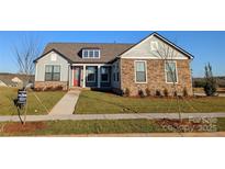 One-story home with gray siding, stone accents, and a red front door at 1846 Yardley St, Rock Hill, SC 29732