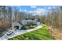 Aerial view of a house with a boat in the garage at 324 Patternote Rd, Mooresville, NC 28117