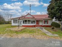 Front view of a charming house with a red roof at 523 Fox Ave, Chester, SC 29706