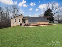 Charming ranch home with a well-manicured lawn and a classic brick exterior at 1769 Old Nc 27 Hwy, Mount Holly, NC 28120