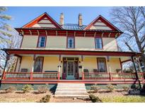 Two-story Victorian home with wrap-around porch and charming details at 106 N Battleground Ave, Kings Mountain, NC 28086