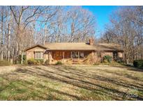 Brick ranch house with covered porch and large yard at 2452 Nc 182 Hwy, Lincolnton, NC 28092