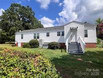 White ranch house with a large yard at 6050 Mcconnells Hwy, McConnells, SC 29726