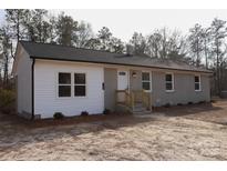 Charming single-story home featuring a combination of brick and siding facade at 868 Monarch Pl, Kershaw, SC 29067