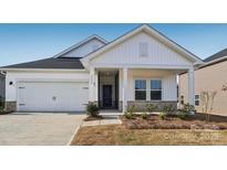 Two-story house with white siding, gray accents, and a covered porch at 1535 Harper Landing Blvd, Stanley, NC 28164