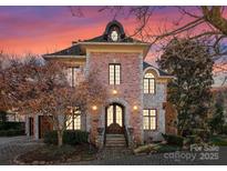 Elegant brick and stone home with a charming architectural design at 2310 La Maison Dr, Charlotte, NC 28226