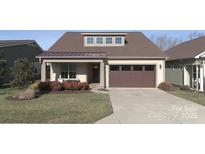 Charming single-Gathering home with a well-maintained lawn and attached two-car garage at 4774 Looking Glass Trl, Denver, NC 28037