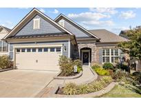 Gray-blue charming craftsman home with beige garage and landscaped front yard at 5259 Sweet Fig Way, Fort Mill, SC 29715