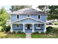 Charming blue two-story house with a front porch at 315 9Th Sw St, Conover, NC 28613