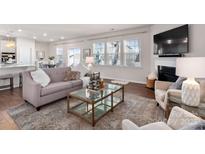 Bright living room with fireplace and large windows at 2547 Bullfrog Ln, Lancaster, SC 29720