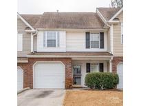 Brick front townhouse with attached garage and landscaping at 11837 Shoemaker Ct, Charlotte, NC 28270