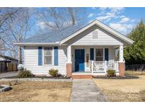 Charming white bungalow with blue accents and a welcoming front porch at 313 Webb St # 88, Albemarle, NC 28001