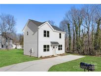 Two-story house with white siding, a driveway, and a grassy yard at 1817 Vista Ter, Statesville, NC 28677