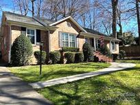 Charming single-story brick home with a well-manicured lawn and inviting curb appeal at 2429 Sugar Mill Rd, Charlotte, NC 28210