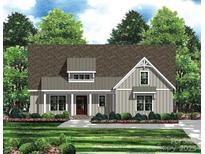 Craftsman style home with gray siding, brown roof, and landscaping at 1502 Baileys Run, Gastonia, NC 28056