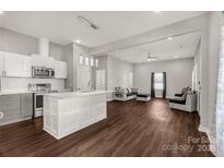 Modern kitchen with white cabinets and a large island at 138 Pinckney St, Chester, SC 29706