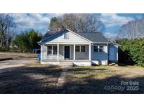 Cozy ranch home with front porch and mature trees at 1529 4Th Ne St, Hickory, NC 28601