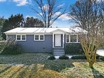 Ranch style home with gray exterior, landscaping, and a spacious front yard at 206 Hunter St, York, SC 29745
