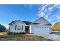 Charming one-story home with gray siding and a two-car garage at 3636 Kimber Ln, Sherrills Ford, NC 28673