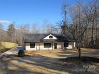 Newly constructed home with a charming front porch and gray roof at 3720 Turner Rd, Clover, SC 29710