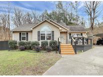 Charming ranch home with landscaped yard and deck at 487 Majestic Se Ct, Concord, NC 28025