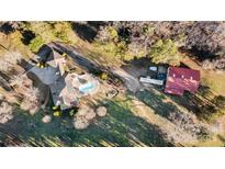 Aerial view showcasing home, pool, and detached shop at 111 Rapids Run Trl # 17, Iron Station, NC 28080