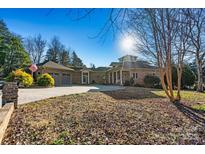 Brick home with attached garage and expansive driveway at 111 Rapids Run Trl # 17, Iron Station, NC 28080