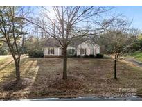 Ranch home with a spacious yard at 2411 Hamilton Mill Rd, Charlotte, NC 28270