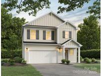 Two-story house with beige siding, gray shutters, and a two-car garage at 3016 Sadler Woods Ln, Charlotte, NC 28214