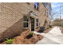 Charming brick townhouse with a well-maintained walkway and landscaping at 3713 Lou Ann Ave, Charlotte, NC 28208