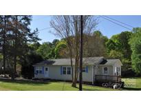 Ranch home with blue shutters, deck, and large yard at 206 Cruse Cir, Salisbury, NC 28146