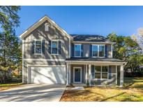 Two-story house with gray siding, white trim, and a two-car garage at 1305 39Th Avenue Nw Pl, Hickory, NC 28601