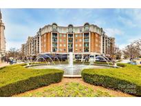 Upscale condo building with fountain and shops at 4620 Piedmont Row Dr # 509, Charlotte, NC 28210