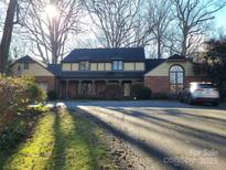 Brick house with a large front yard and a long driveway at 625 3Rd Ne St, Hickory, NC 28601