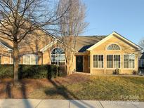 Inviting ranch home with stone accents and a sunroom at 5559 Prosperity View Dr, Charlotte, NC 28269