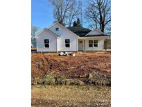 Newly constructed home with white siding, a dark roof, and a covered porch at 1200-1 Stanton Dr, Shelby, NC