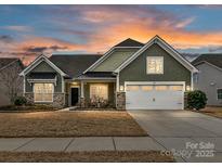 Stunning two-story home with stone accents and a 2-car garage at 1410 Tranquility Blvd, Lancaster, SC 29720